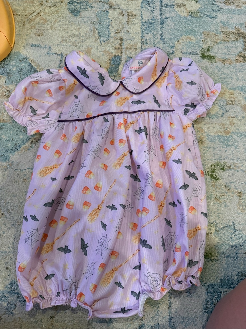 Smocked Lilac Halloween One-Piece Romper with Candy Corn Print